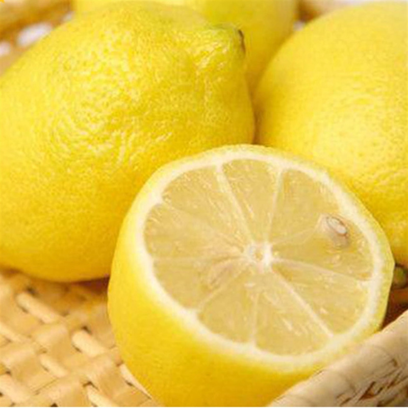 Fresh lemons and fresh yolk fruit, milk and tea.