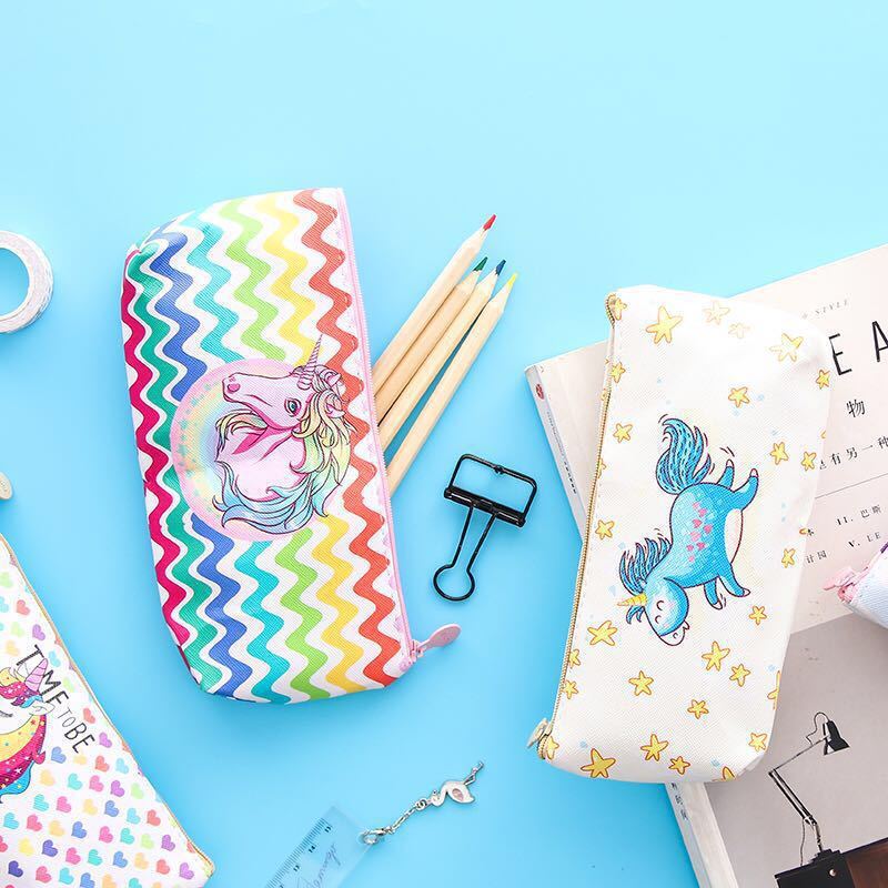 A young girl with a leather-brained unicorn pen bag for schoolgirls.