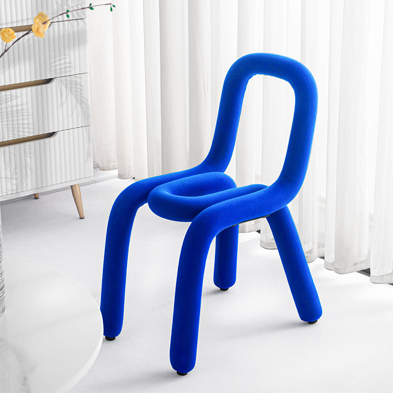 The Klein Blue family used the bedroom dressing table to create the Bold Chair bench designer's recital chair.