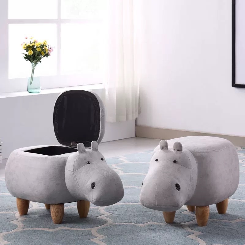 At the door, the idea of changing a shoe stool is to put a wooden hippo in a shoe stool.