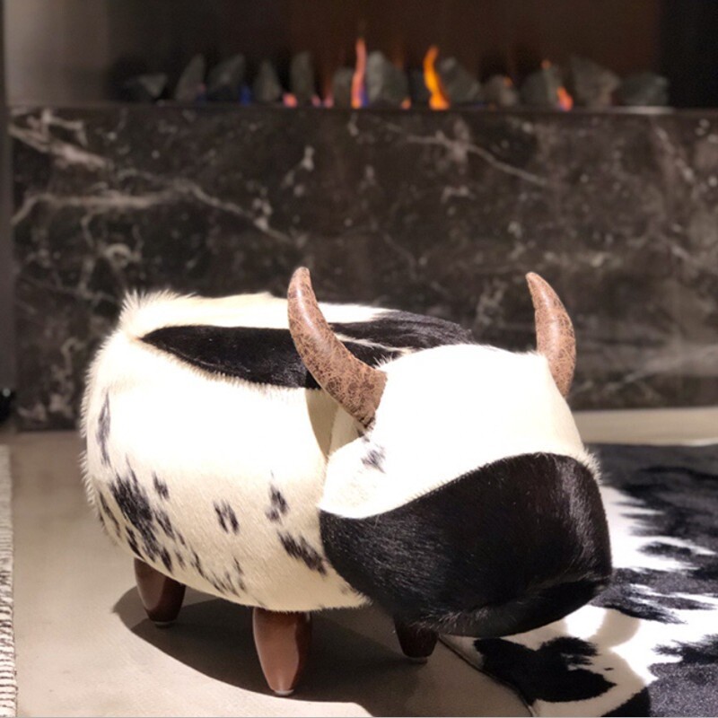 The designer's furry calf's own creative animal hat room and shoe stools in the foot stool living room.