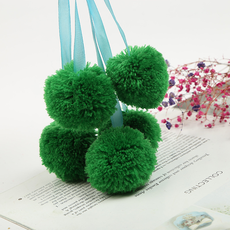 The spot green ribbon is wholesaled to a handmade cashmere factory with four centimetres of barley balls.