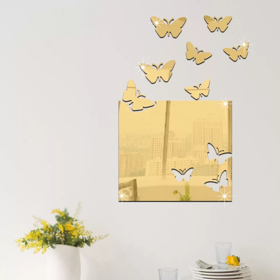 A mirror wall with a large box of butterflies on the wall of the living room.