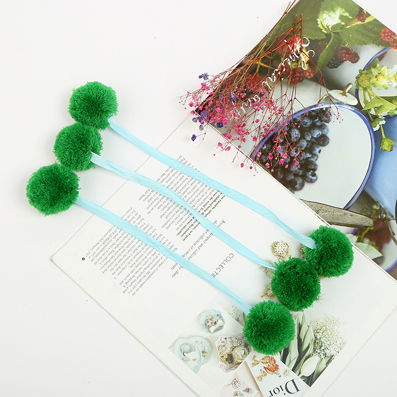 The spot green ribbon is wholesaled to a handmade cashmere factory with four centimetres of barley balls.