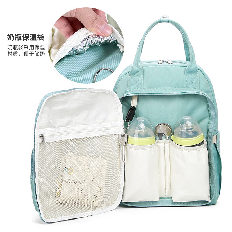 Mommy packs two-shouldered multi-purpose mother and child packs with a large capacity to travel to keep the mother warm and wet.