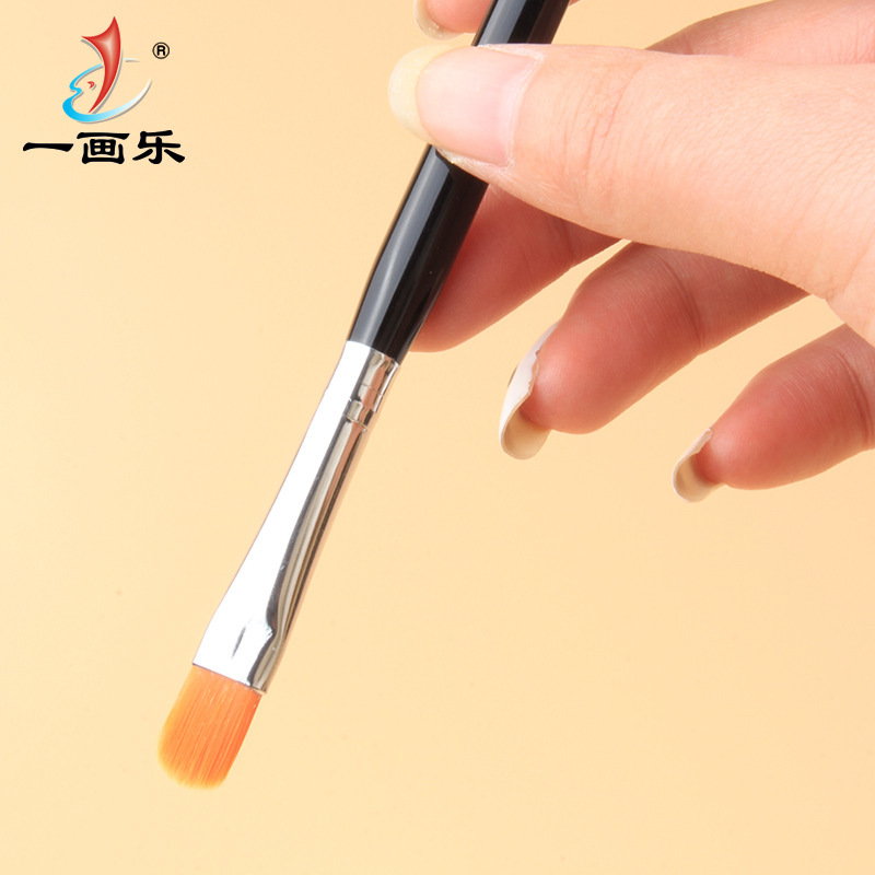 The manufacturer customises a manicure pen, a nail-colored brush with a round-head.