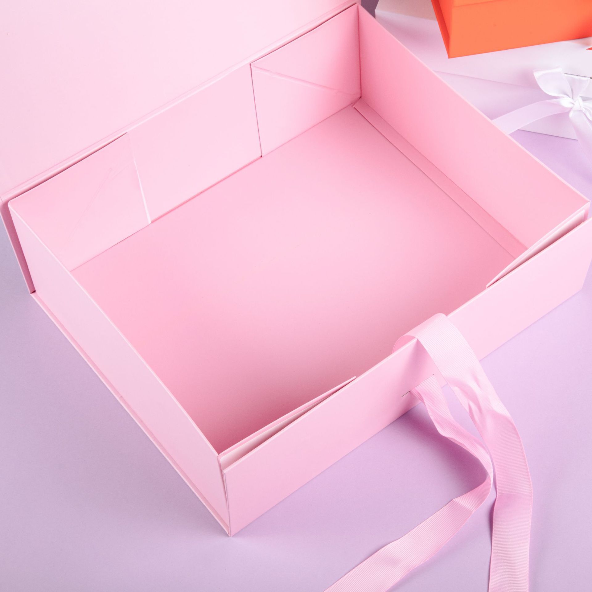 An empty box of short-hand, folded-in-fashion gift boxes for birthdays