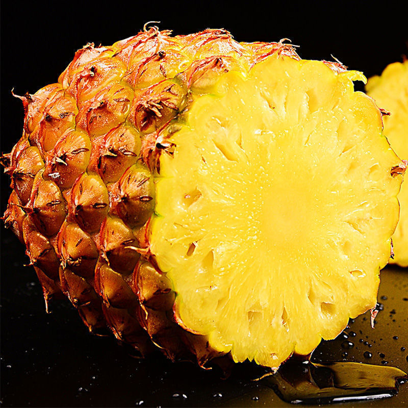 A box full of pineapple-sweet fruit hand torn out of the pineapple and juicy pineapple.