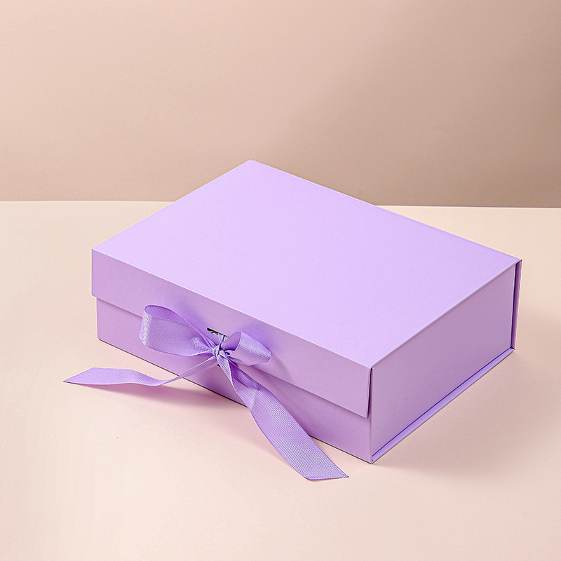 An empty box of short-hand, folded-in-fashion gift boxes for birthdays