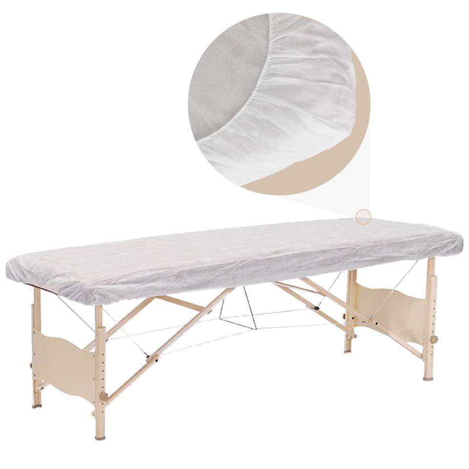 Giường chống bụi một lần bao phủ một chiếc giường mát xa không gió xoáy với các tấm trải giường đã được gắn chặt