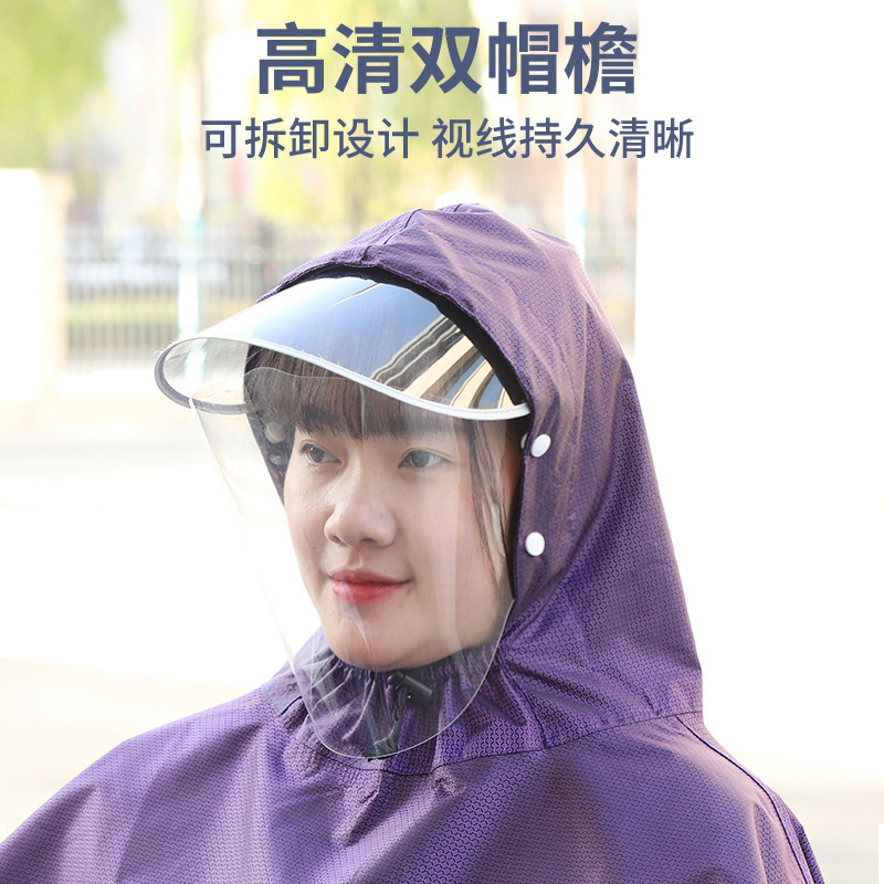 A man and a woman who have a long-term raincoat with a mirror and an adult riding a new rain cap.