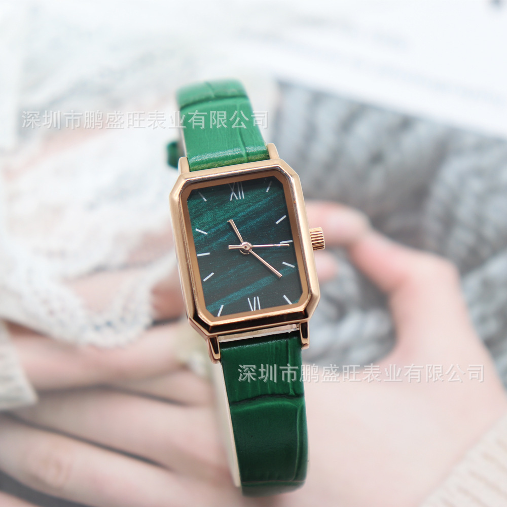 The new stylist retro fashions a little green watch.