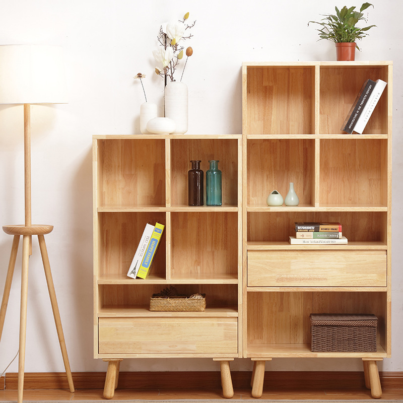 The bookcase displays the green furniture of the library.