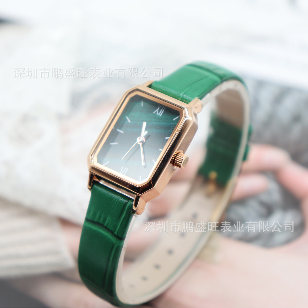 The new stylist retro fashions a little green watch.