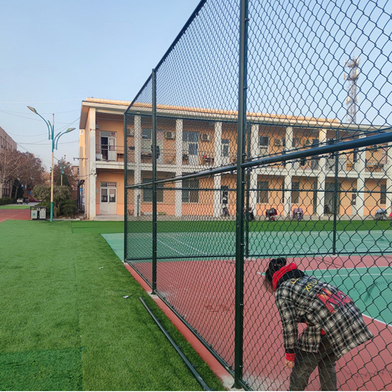 Basketball court fenced stadium protected against wire fenced tennis court fences