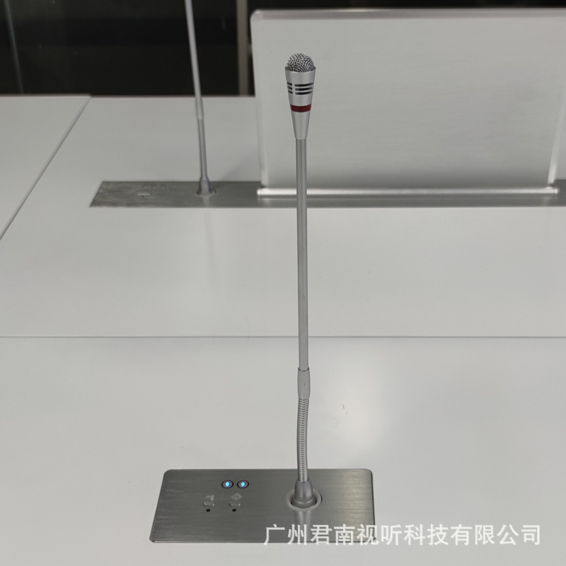 The table of Junnan's conference room is customised to the microphone's hidden noise office chair.