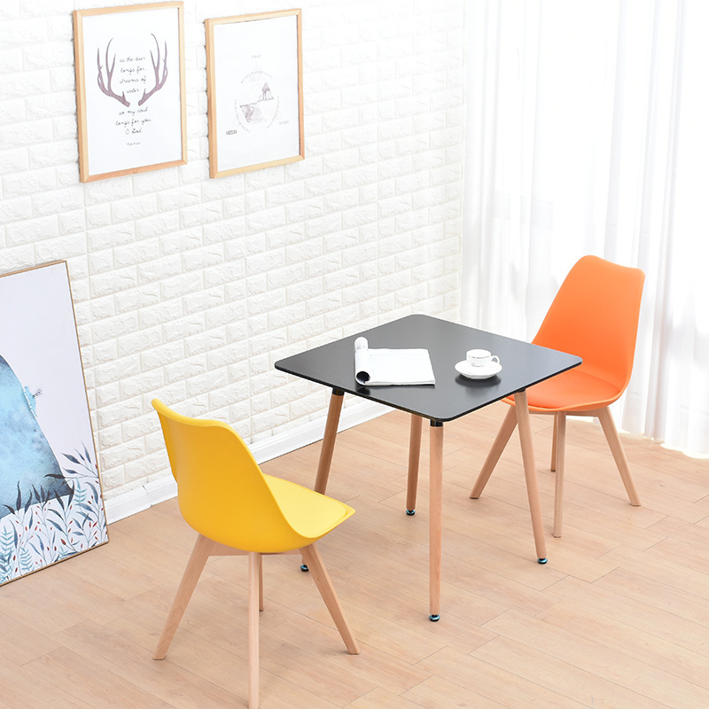 A simple, small, home-based, modern Nordic leisure table, square white table for four people.