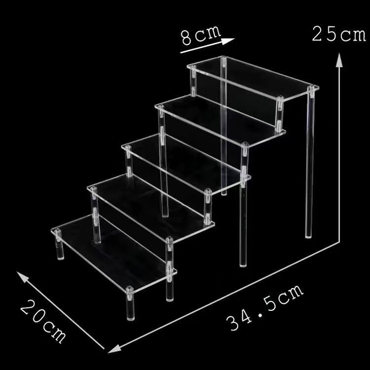 Trong suốt Chiếc hộp che mắt Akry hiển thị một kệ với một bong bóng thang nhiều tầng với búp bê Matt.