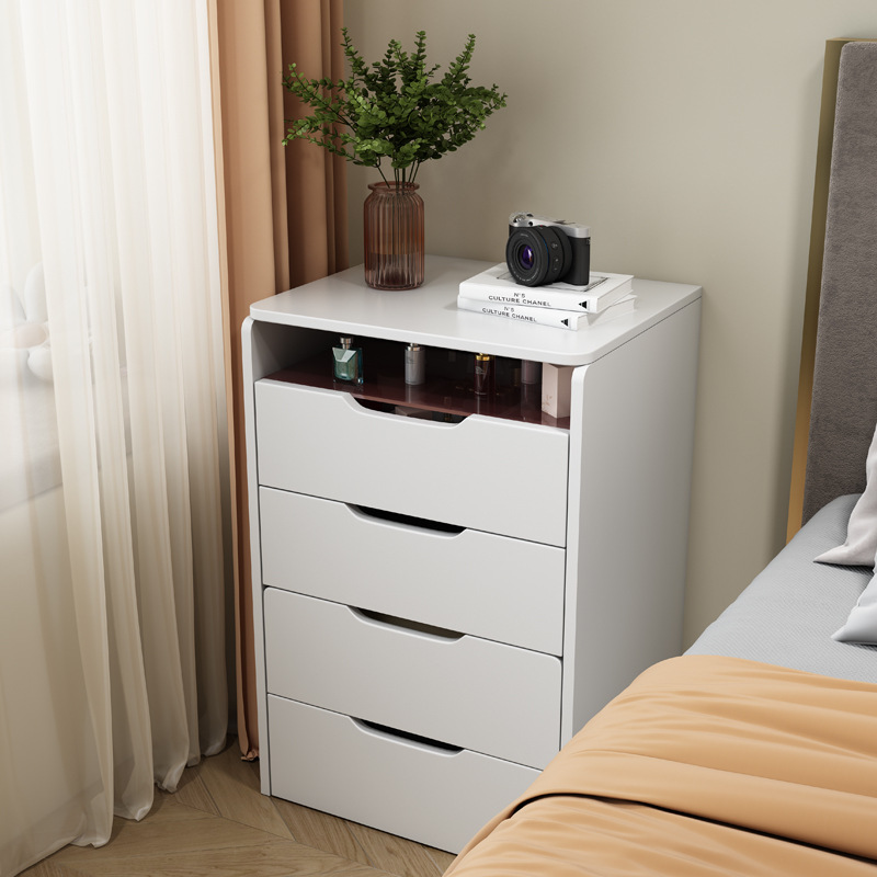 A small, modern-day small-room dresser with a small bed with a mini-coup counter.