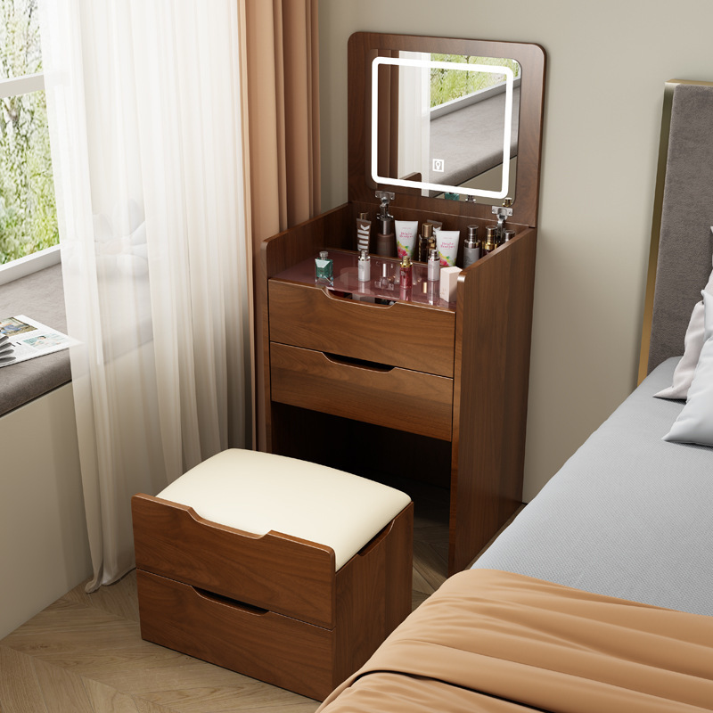 A small, modern-day small-room dresser with a small bed with a mini-coup counter.