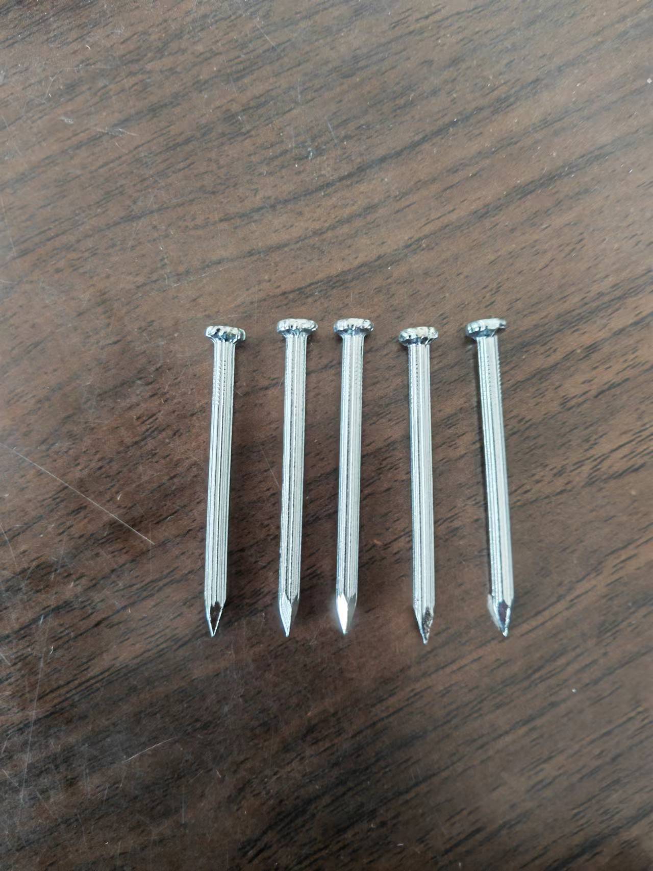 Tuck nails, vertical nails, electroplating, cement nails, export quality vertical nails.