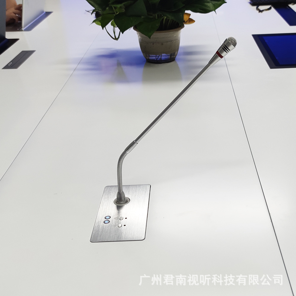 The table of Junnan's conference room is customised to the microphone's hidden noise office chair.