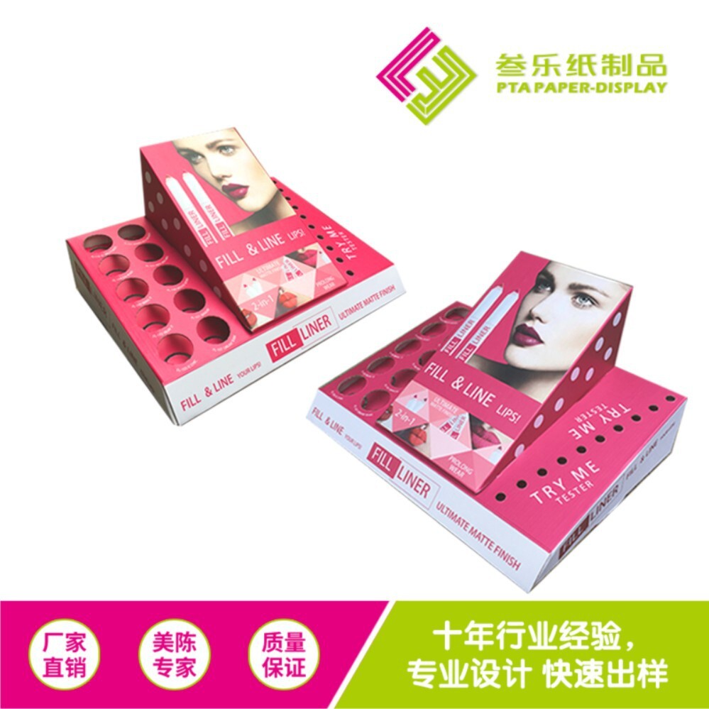 A cardboard display of a box of cosmetics on the surface of a box of candy hair and accessories.