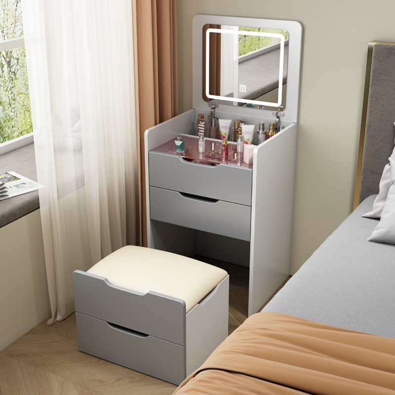 A small, modern-day small-room dresser with a small bed with a mini-coup counter.