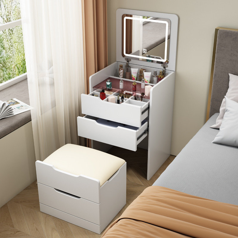 A small, modern-day small-room dresser with a small bed with a mini-coup counter.