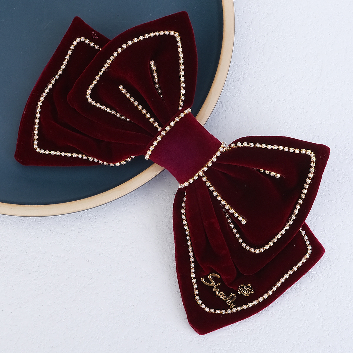 A big red butterfly with red velvet on the top, leading the way to the back of the girl's head.