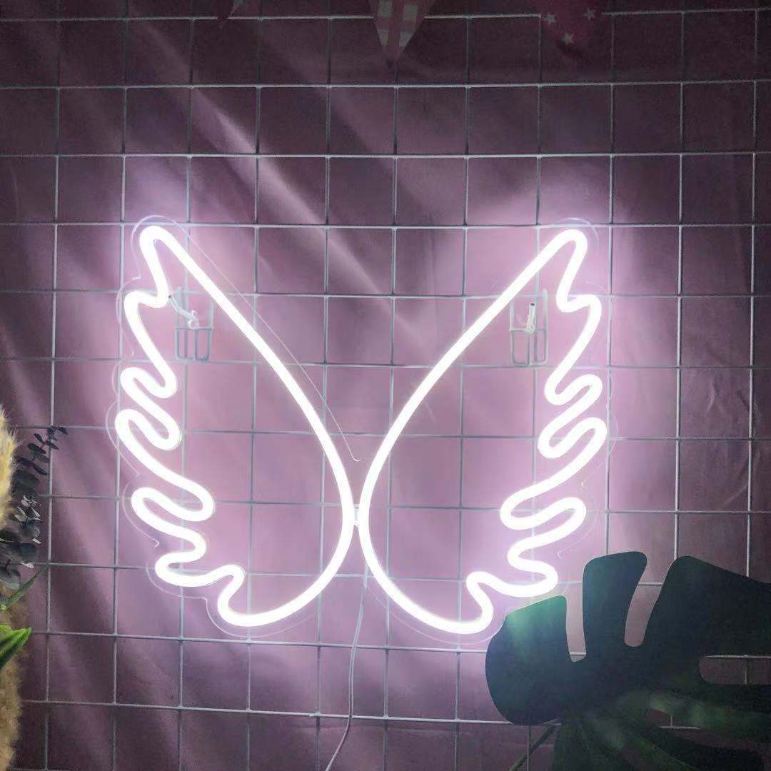 The wings of the new led neon light interior decorated with a transparent backboard of neon light child gift angel.