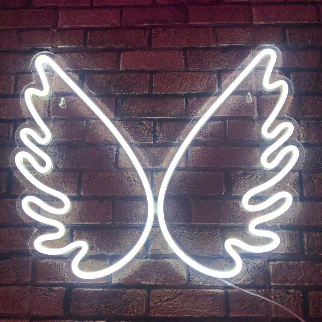 The wings of the new led neon light interior decorated with a transparent backboard of neon light child gift angel.