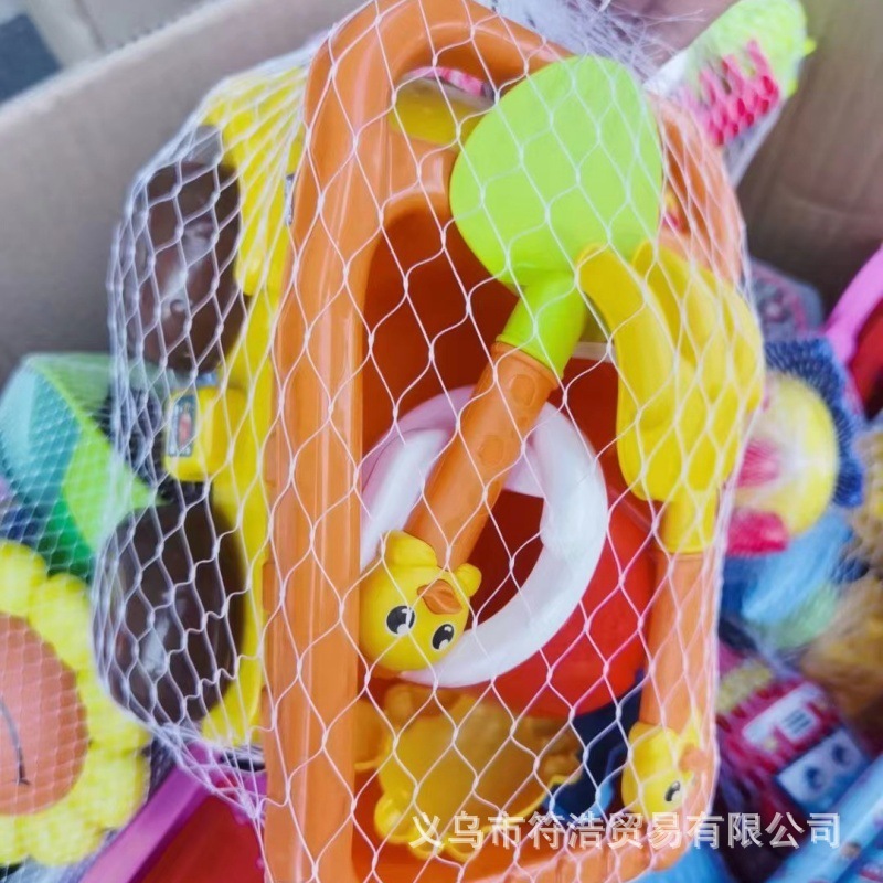 Summer is called the beach toy set up with children on the beach to dig for sand shovels and sand buckets.