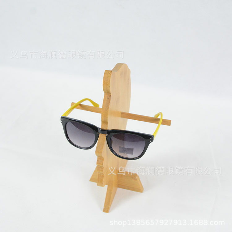 The sunglasses of the trophies show the windows of the wooden creative glasses shop.