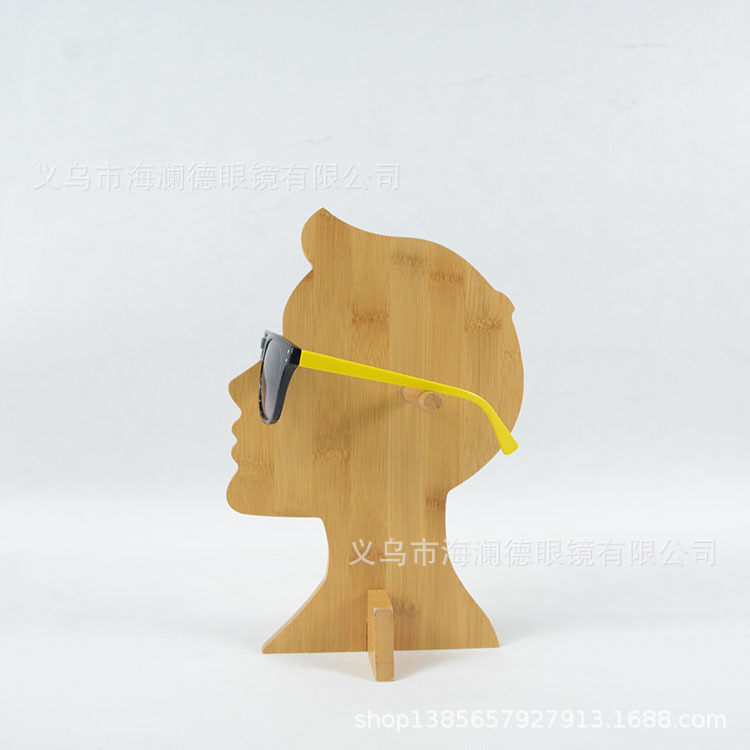 The sunglasses of the trophies show the windows of the wooden creative glasses shop.