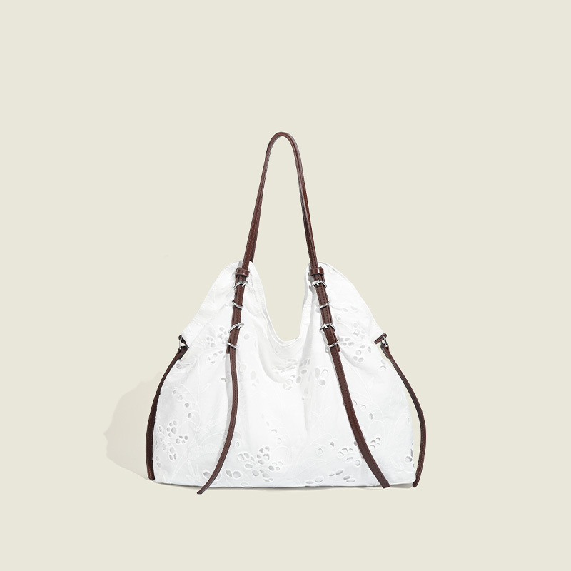 White large-capacity hand-carrying bag for a summer light and light commuter trip.