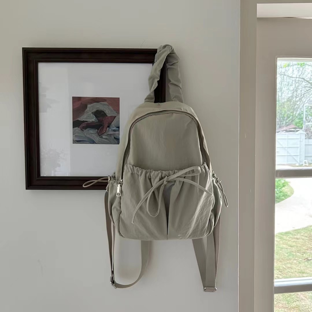 The new 2024 Korean mini-Nilong double-shouldered outdoor backpacks lightened up with a big-capacity student bag.