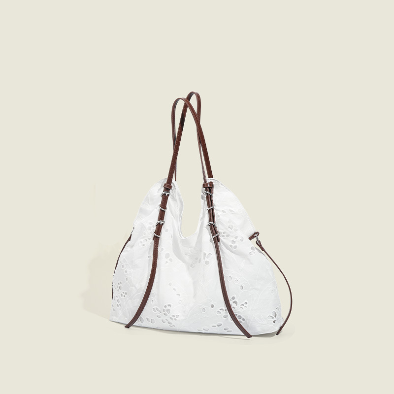 White large-capacity hand-carrying bag for a summer light and light commuter trip.