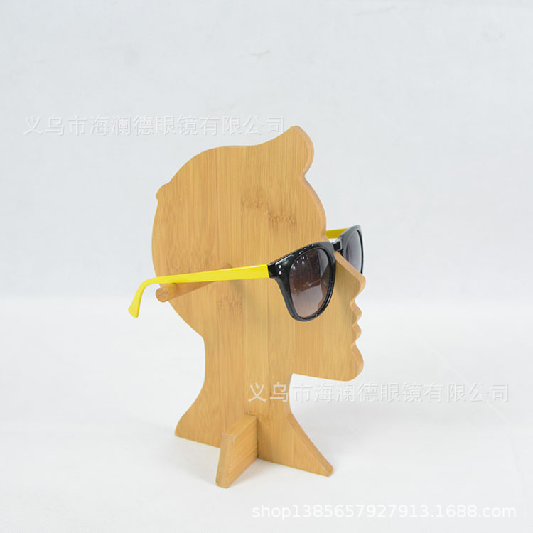 The sunglasses of the trophies show the windows of the wooden creative glasses shop.