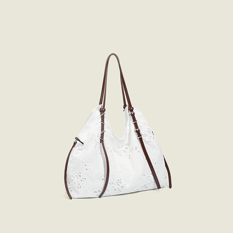 White large-capacity hand-carrying bag for a summer light and light commuter trip.