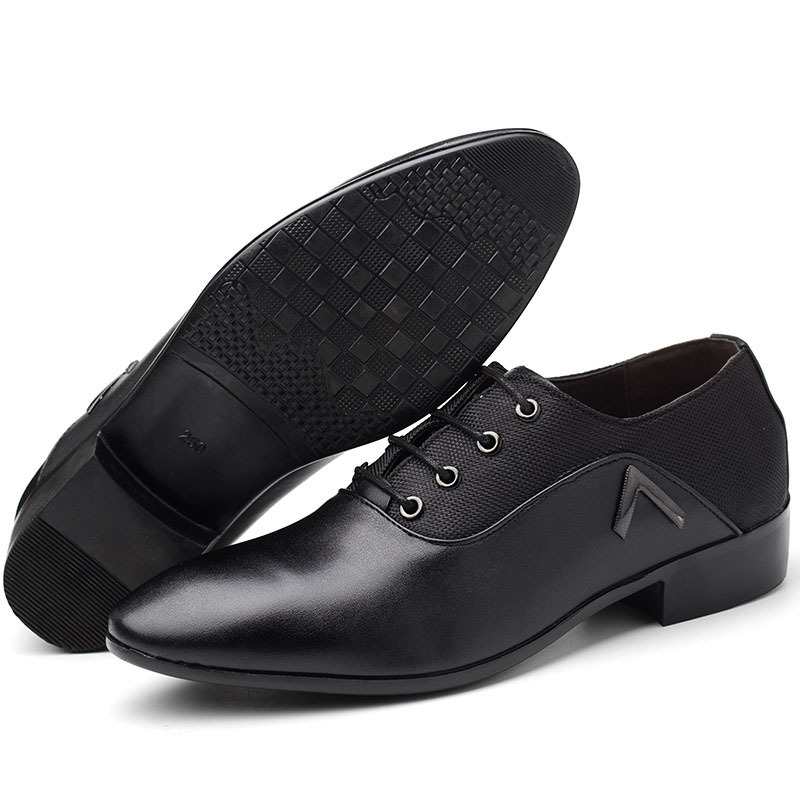The man's shoes are in the middle of a man's shoes.