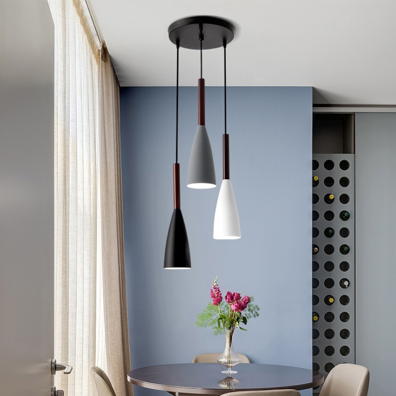 Nordic dining room lights are about the size of a small chandelier with a black-and-white restaurant lamp in a single, modern home.