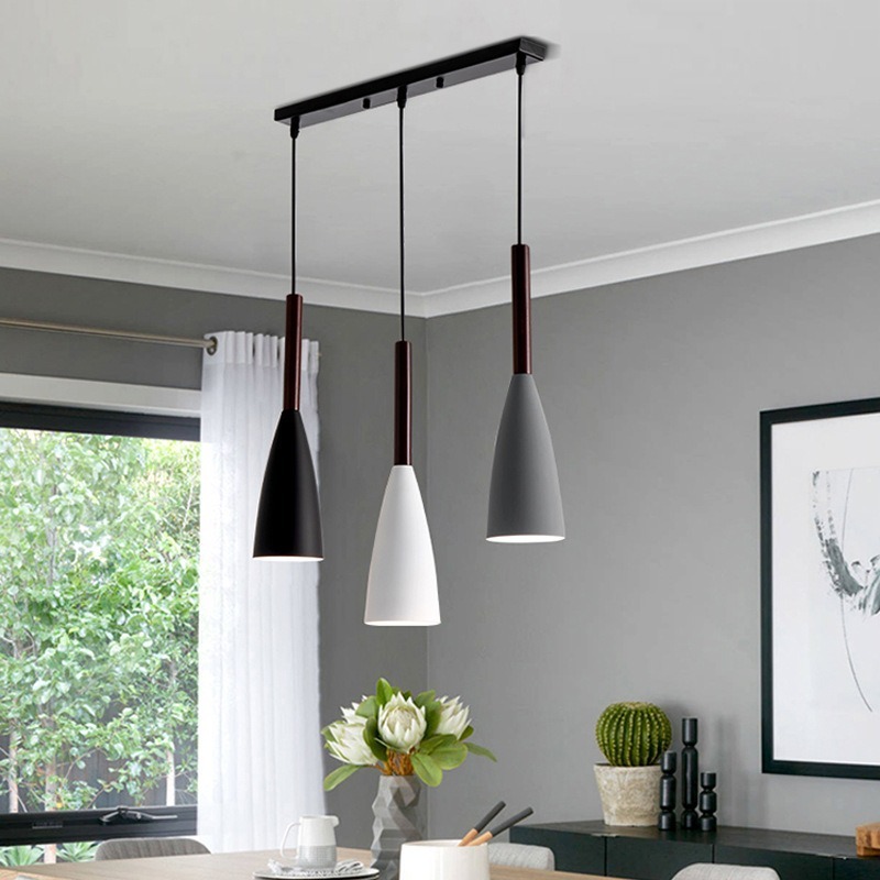 Nordic dining room lights are about the size of a small chandelier with a black-and-white restaurant lamp in a single, modern home.