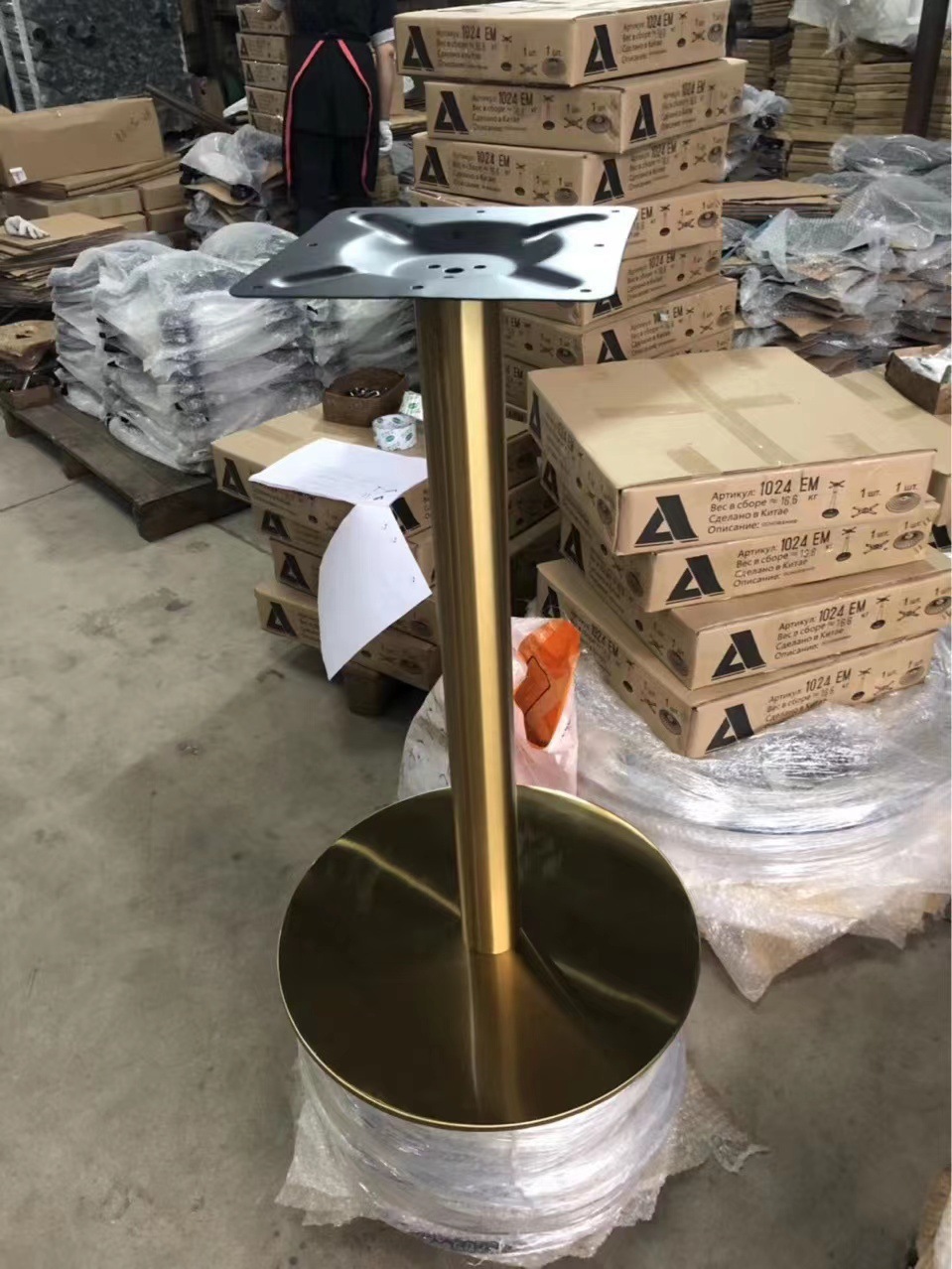 Two-person table-top table with a table full of gold for the foot of the mill's stainless steel-laced table.