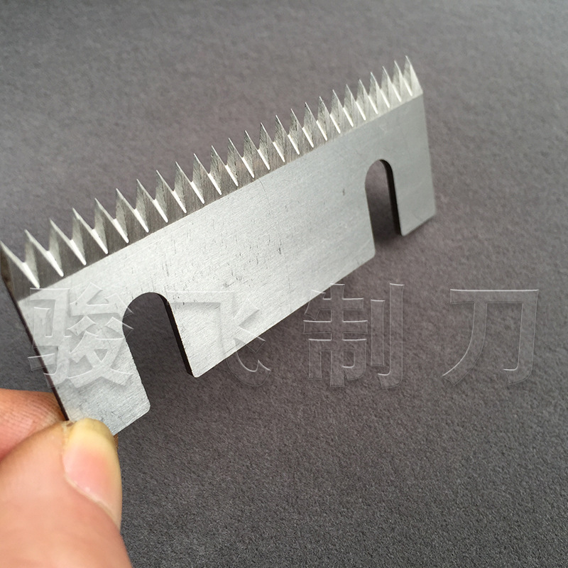 The taped cutter seals the carton with a tooth-slashed blade.