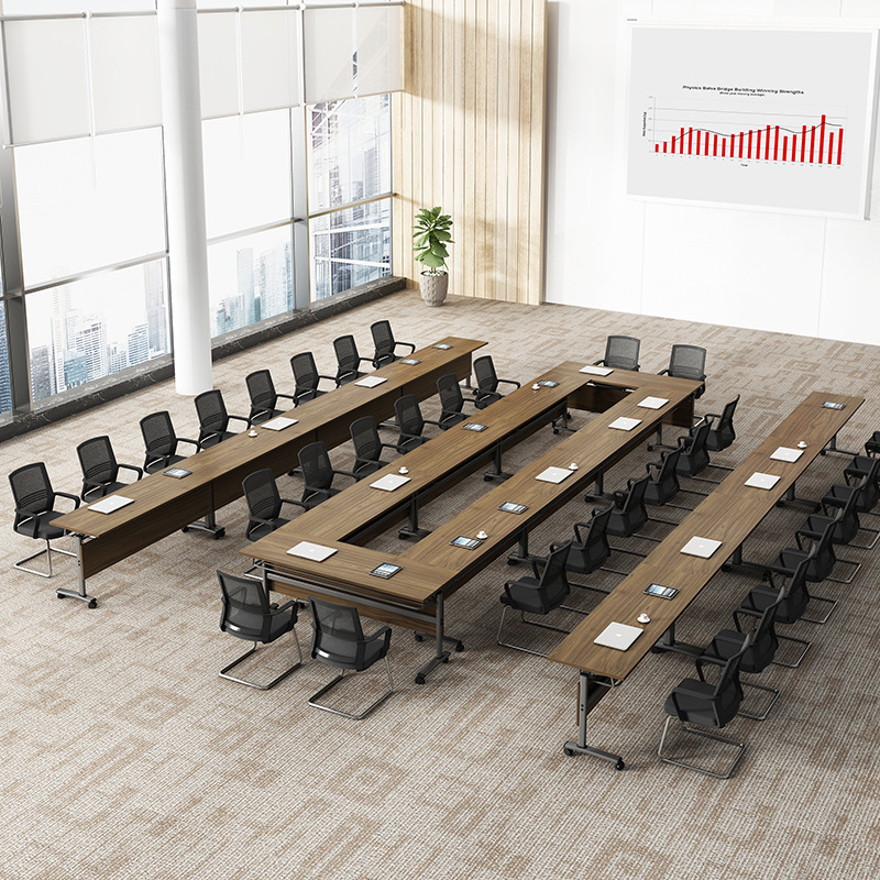 Students are able to fold training tables and chairs with long stacks of pairs to move double floor office tables at the Roller Hotel