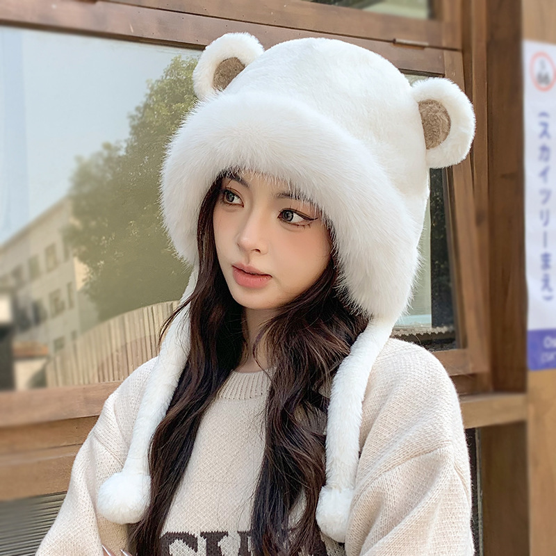 Cutie bear, the hot hat girl, the red hat girl, riding a hood for ear protection outside of the house in autumn and winter.