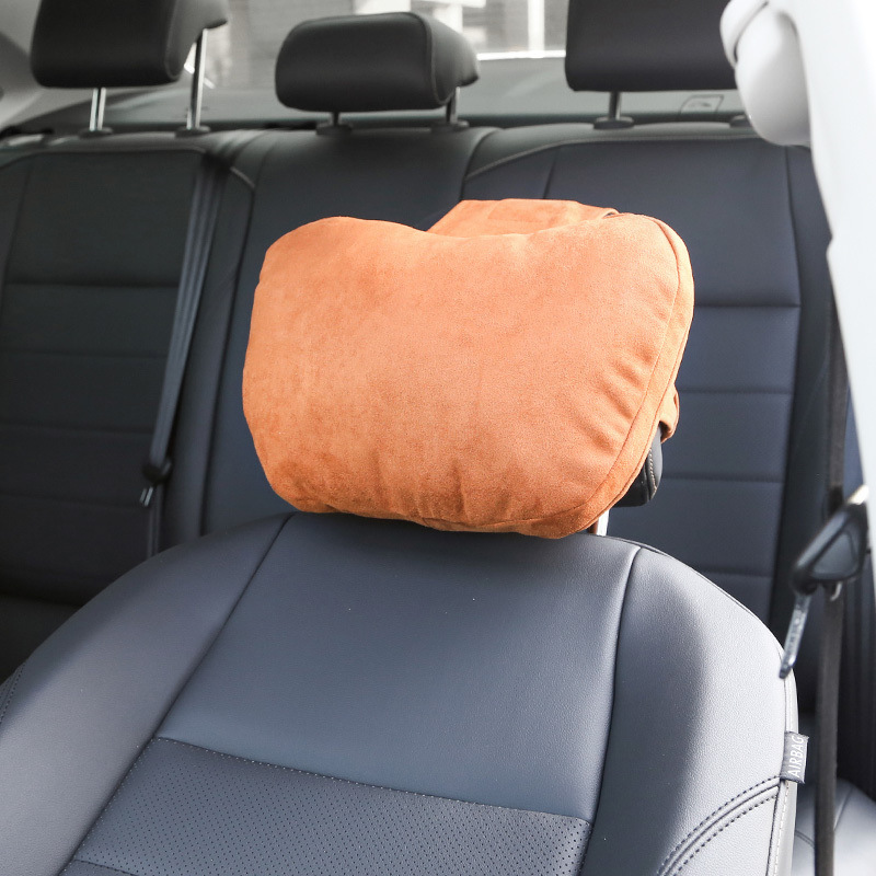 A pair of pillows used in a car's neck pillow in a Mercedes Mabahs-class car.