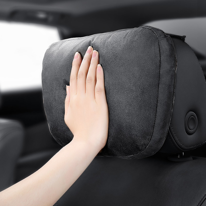 A pair of pillows used in a car's neck pillow in a Mercedes Mabahs-class car.