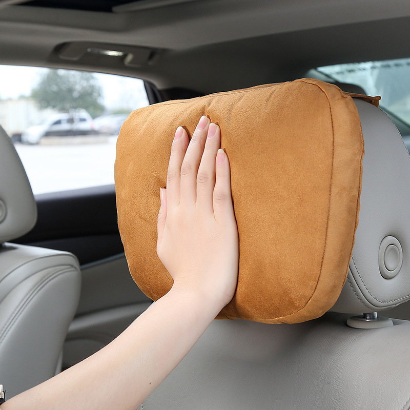 A pair of pillows used in a car's neck pillow in a Mercedes Mabahs-class car.